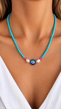 Collier turquoise œil ou pampilles noires