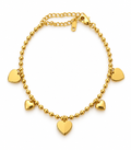 Bracelet doré à perles et pendentifs cœur